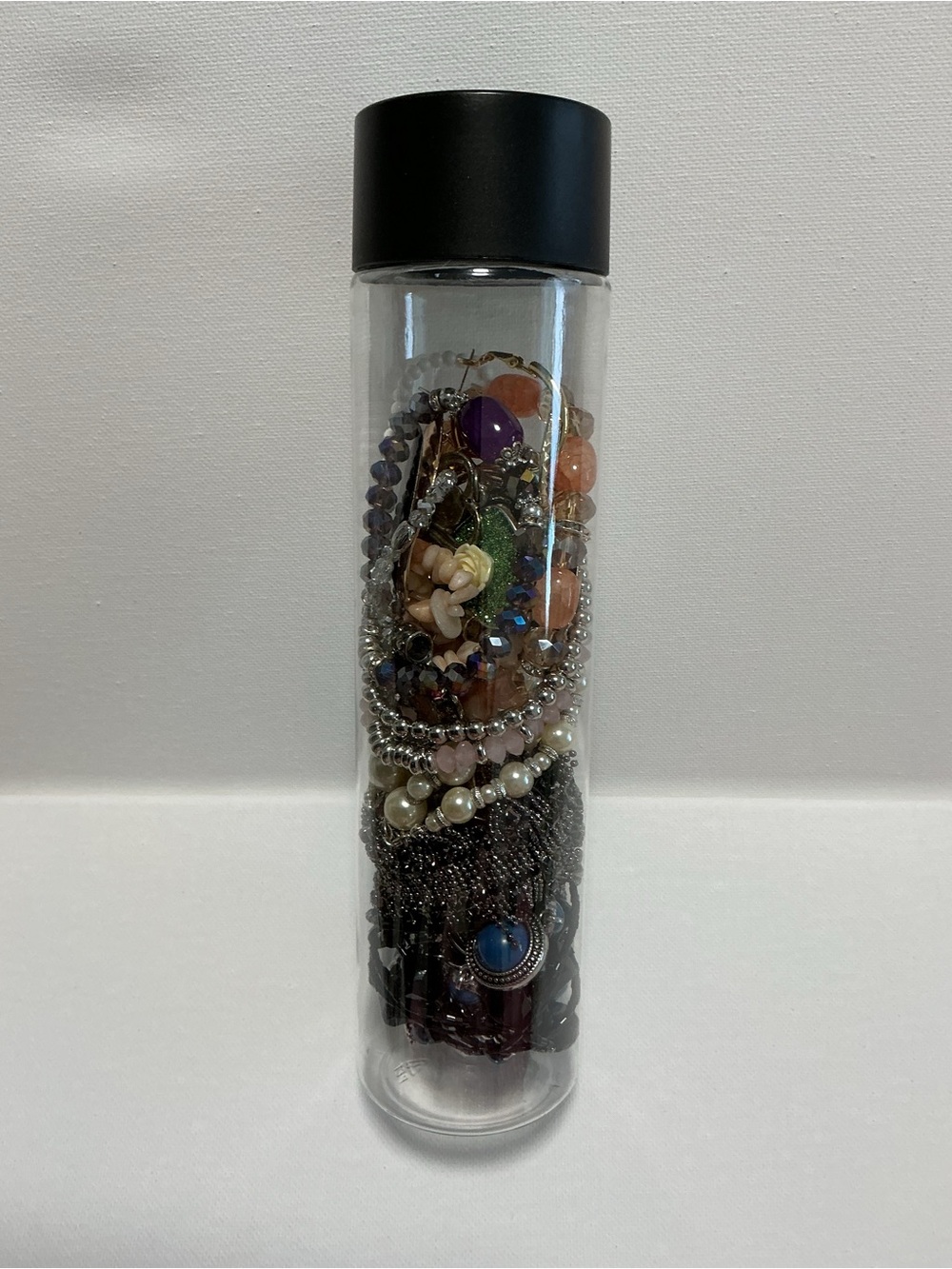 Clear Jewelry Tube Filled with 25 Mixed Costume Jewelry - Multicolor Items.